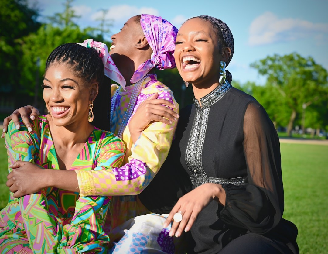 Group of 3 friends, laughing and enjoying themselves. National Mall, Washington, DC USA.